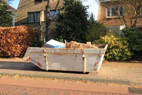 Builders skip filled with construction debris on a Covent Garden site